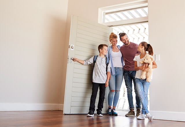 Family in new home purchased with funds from a cash-out second mortgage loan on their primary residence